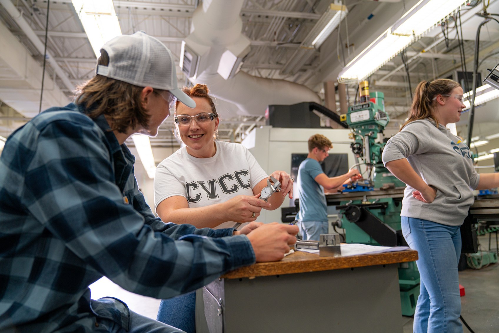 Students working in a machine shop